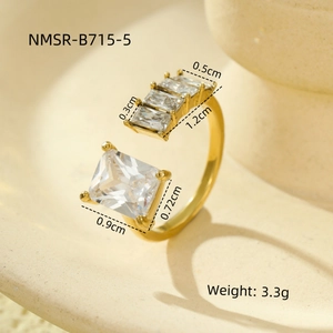 Detail view of gold titanium ring showing square zircon inlay dimensions and 3.3g weight