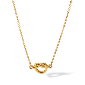 Polished gold stainless steel heart knot necklace on a minimalist white background