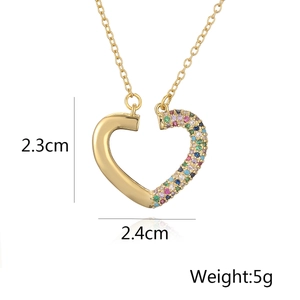 Close-up of heart pendant with gold finish and colorful zircons measuring 2.4cm