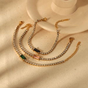 Gold plated stainless steel tennis bracelet set with emerald, pink, and black stones