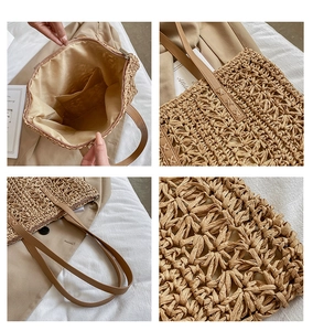 Detail view of woven straw tote bag featuring internal zipper pocket and fine texture
