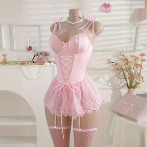 Pink lace lingerie set detail featuring corset lace-up front and scalloped hemline