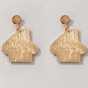 Detail of gold house-shaped stud earrings featuring a textured brushed metal finish