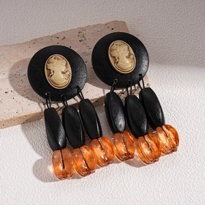 Gothic acrylic wood bead drop earrings with golden cameo portrait and oval orange beads