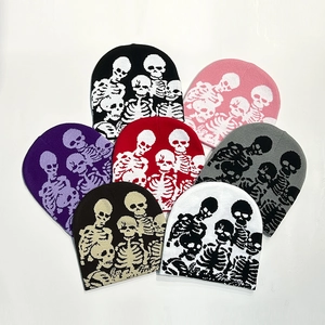 Detailed fan-shaped arrangement of knitted beanies with skull patterns in seven colors