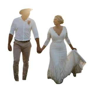 Elegant white lace wedding dress with V-neck and long sleeves shown on a couple model
