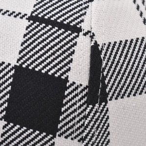 Close-up of thick houndstooth pattern fabric and clean stitching on a baseball cap