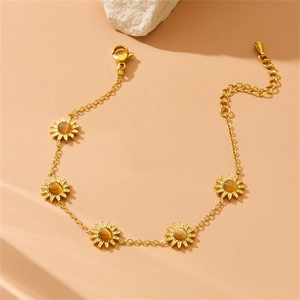 Gold plated stainless steel bracelet with five sunflower charms and cat eye stone inserts