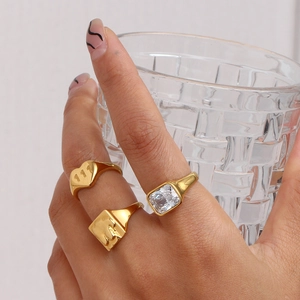 Gold vintage ring set with heart shape 111 engraving and square zircon gemstone