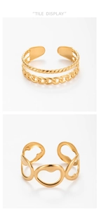 Macro detail of golden open cuff bracelets with twisted rope and hollow wave patterns