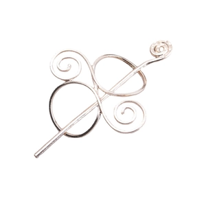 Viking Celtic metal hair pin with spiral ring design for women on white background