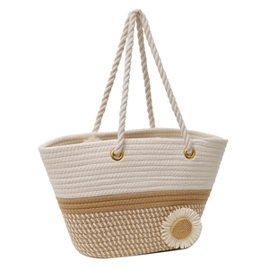 Handwoven straw tote bag with dual-tone beige design and white sunflower ornament