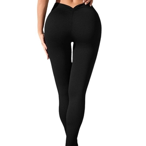 High waist black yoga leggings with V-cut back and peach lift effect on white background