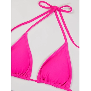 Detail of bright pink halter triangle bikini top with pleated cups and adjustable ties