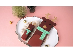 Detail of reindeer themed Christmas chocolate cards in two sizes on a white decorative plate