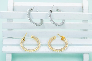 Fashionable C-shaped hoop earrings with pearls and rhinestones in gold and silver finish