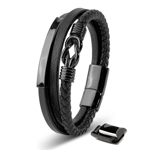 Close-up of black braided leather bracelet with polished metal plate and magnetic clasp