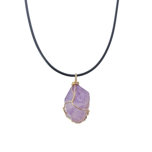 Handmade amethyst crystal necklace with gold wire wrap on a black cord strap