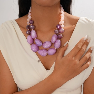 Detail of double-layer acrylic necklace with gradient purple marble beads and gold spacers