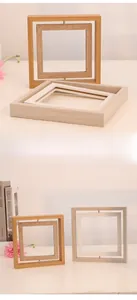 Detail of creative double-sided rotating wooden photo frame for desk display