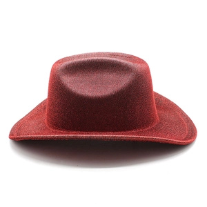 Detail of red glitter cowboy hat showing shiny texture and western style for parties