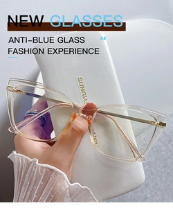 Detail of transparent tea-colored cat-eye glasses with anti-blue light lenses and metal arms