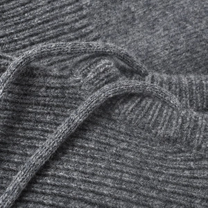 Women's warm oversized wool knit beanie in dark grey with ribbed texture and drawstring