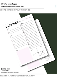 Detail of tear-off daily planner page with schedule, tasks, and habit tracking modules
