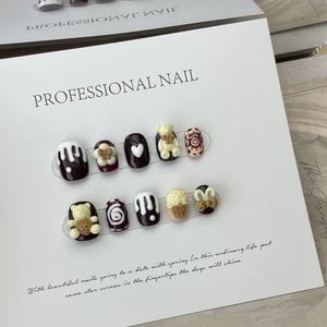 Handmade brown and white 3D bear press-on nails with cream texture and heart motifs