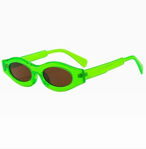 Detail view of neon green Y2K oval sunglasses with dark lenses and inner temple specs