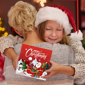 Coffret journal de Noël DIY avec carte Merry Christmas dans une scène de cadeau familial