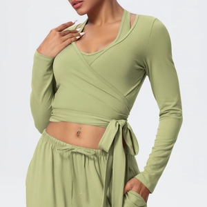 Detail of cross-strap V-neck long sleeve yoga top and drawstring joggers set in sage green