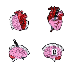 Set of 4 creative anatomical brain and heart enamel pins with motivational quotes