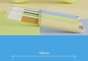Detailed view of three colorful 182mm silicone pet toothbrushes with protective caps