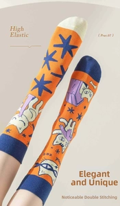 Detail of high elastic orange cotton sock with cat pattern and reinforced ribbing