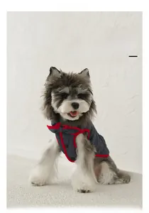 Close-up of pet denim quilted vest with doll collar and bow detail for dogs