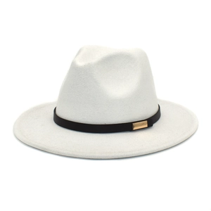 Detail of white wool fedora hat featuring a black band and rectangular gold buckle accent