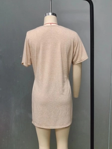 Close-up of beige knit fabric and round neckline detail on women's casual set