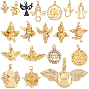 Golden and black angel pendants with zircons for DIY jewelry making on white background