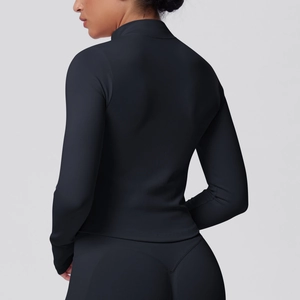 Macro view of seamless ribbed texture and stitching on high-stretch yoga jacket
