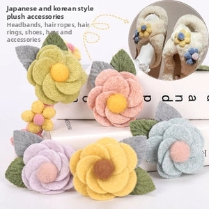 Detailed view of colorful plush flower ornaments for hair accessories and DIY shoe decoration