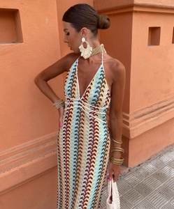 Detail of bohemian knit dress with colorful wave stripes and open back crochet design