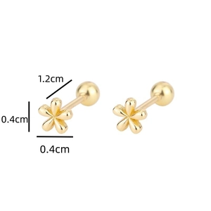 Detailed view of tiny 0.4cm gold flower screw back earrings in minimalist style