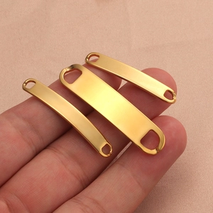 Detailed view of three gold-plated stainless steel curved bar connectors in varied sizes
