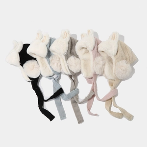 Detailed flat lay of five colors of plush rabbit ear winter aviator hats for children