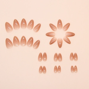 Almond-shaped press-on nails with light brown and gold glitter gradient finish