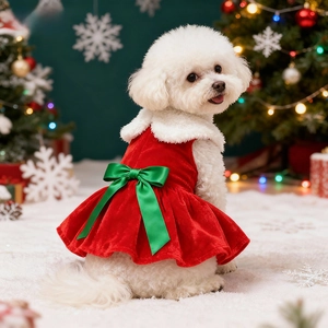 Detail of red velvet Christmas dog dress featuring a green satin bow and white faux fur collar