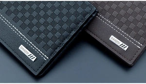 Detail of checkered embossed leather wallets in black and brown with fine stitching