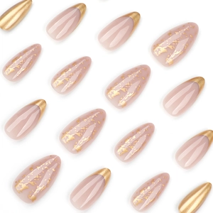 Short almond press-on nails with golden french tips and glitter flakes on nude pink base