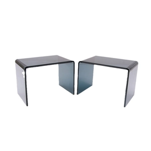 Set of two thick acrylic U-shaped shelving units in transparent smoke grey finish